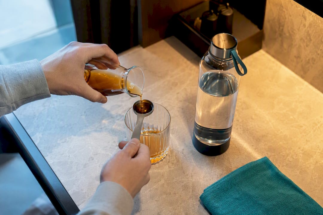 Measured cordial being diluted with water